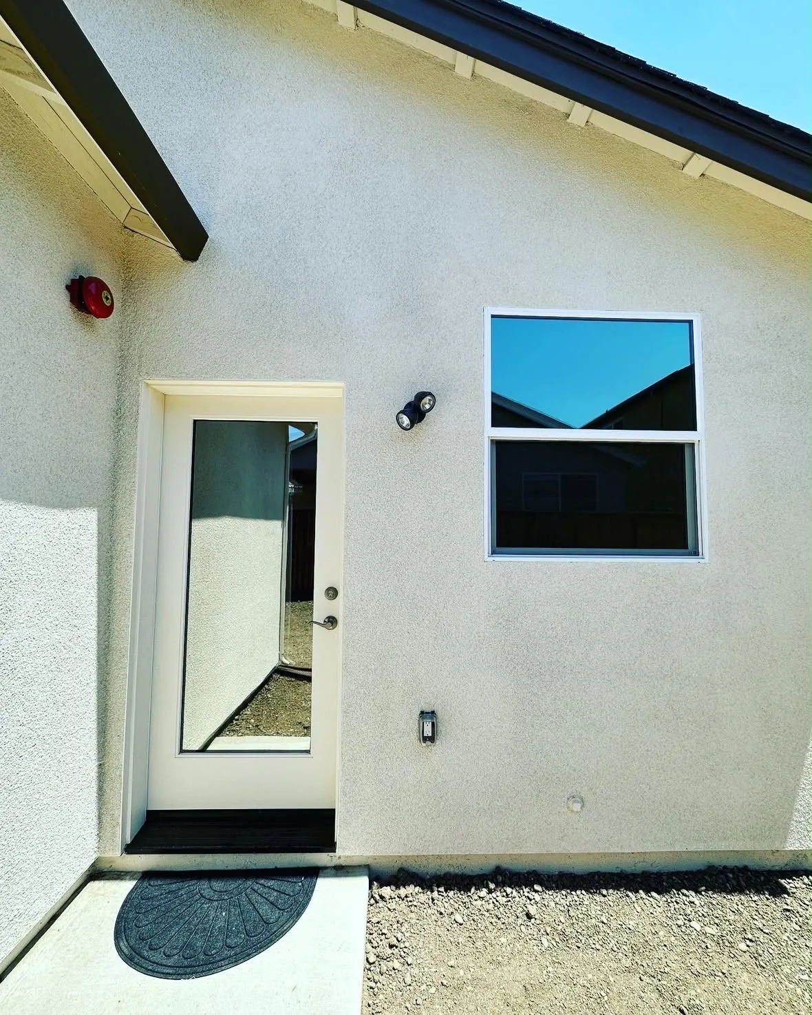 A home entry door and window with residential window film