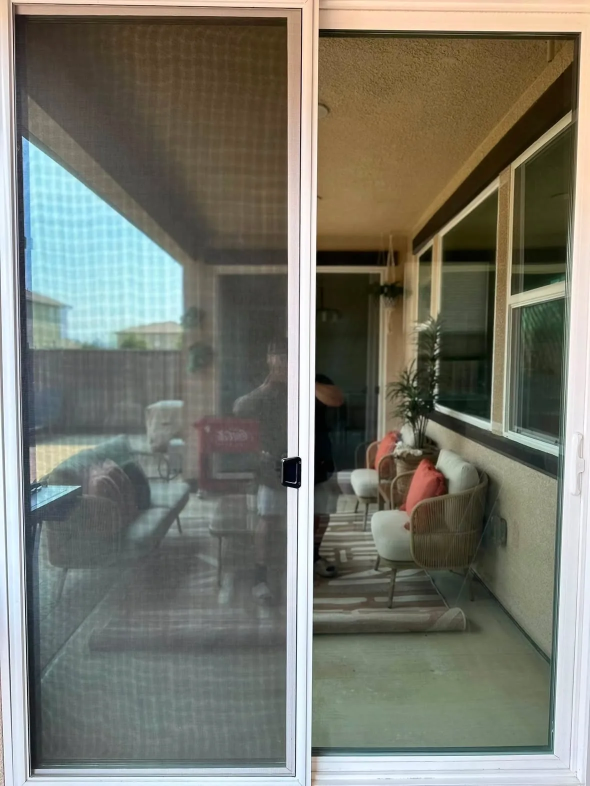 A patio sliding door with residential window film installed